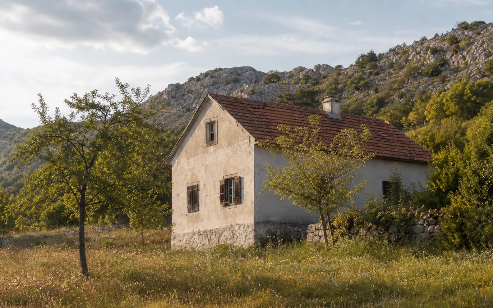 Illustrative photo for Dugopolje, Gračac: a residential exterior set within an open landscape.