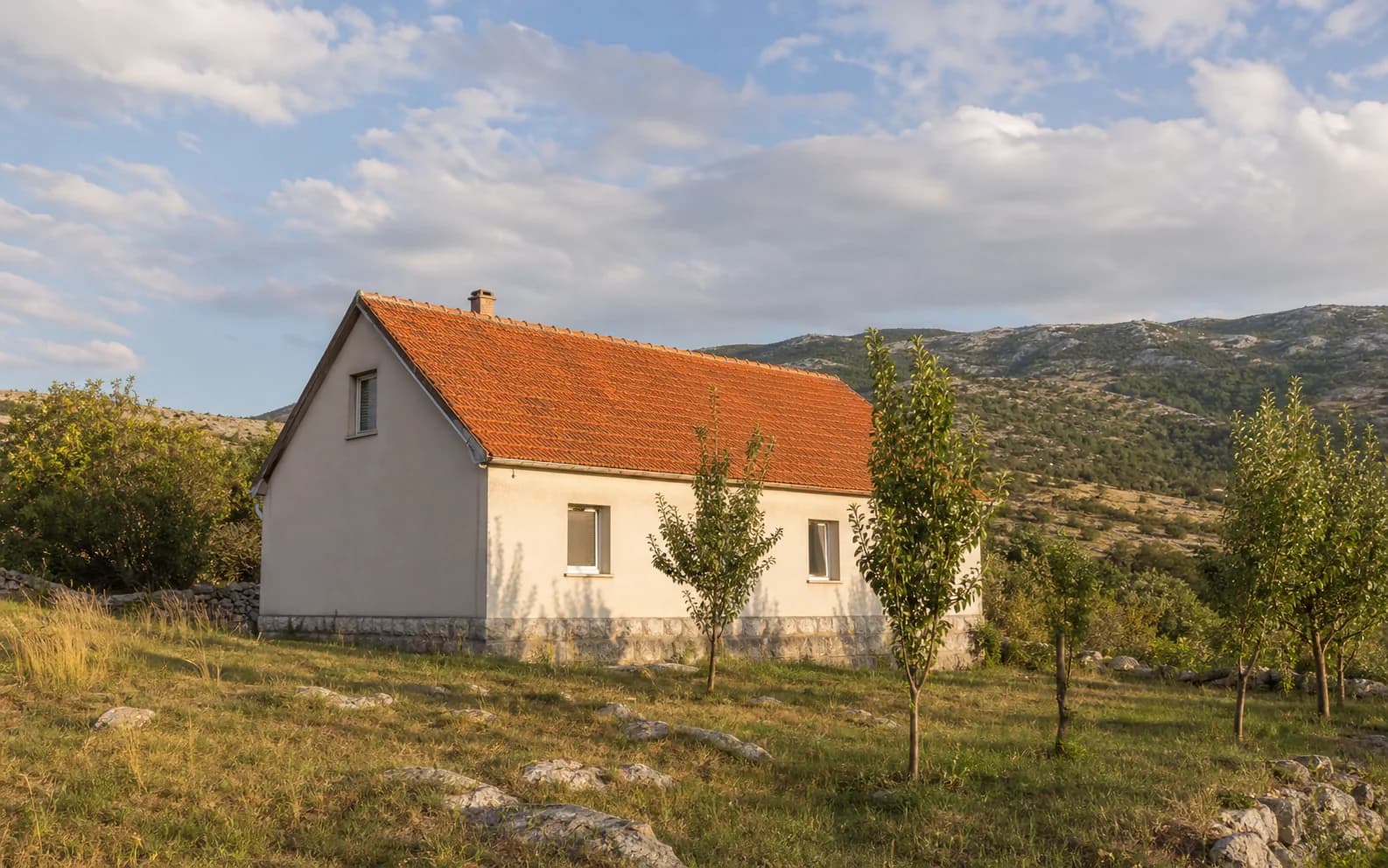 Illustrative photo for Gornja Suvaja, Gračac: a residential exterior set within an open landscape.