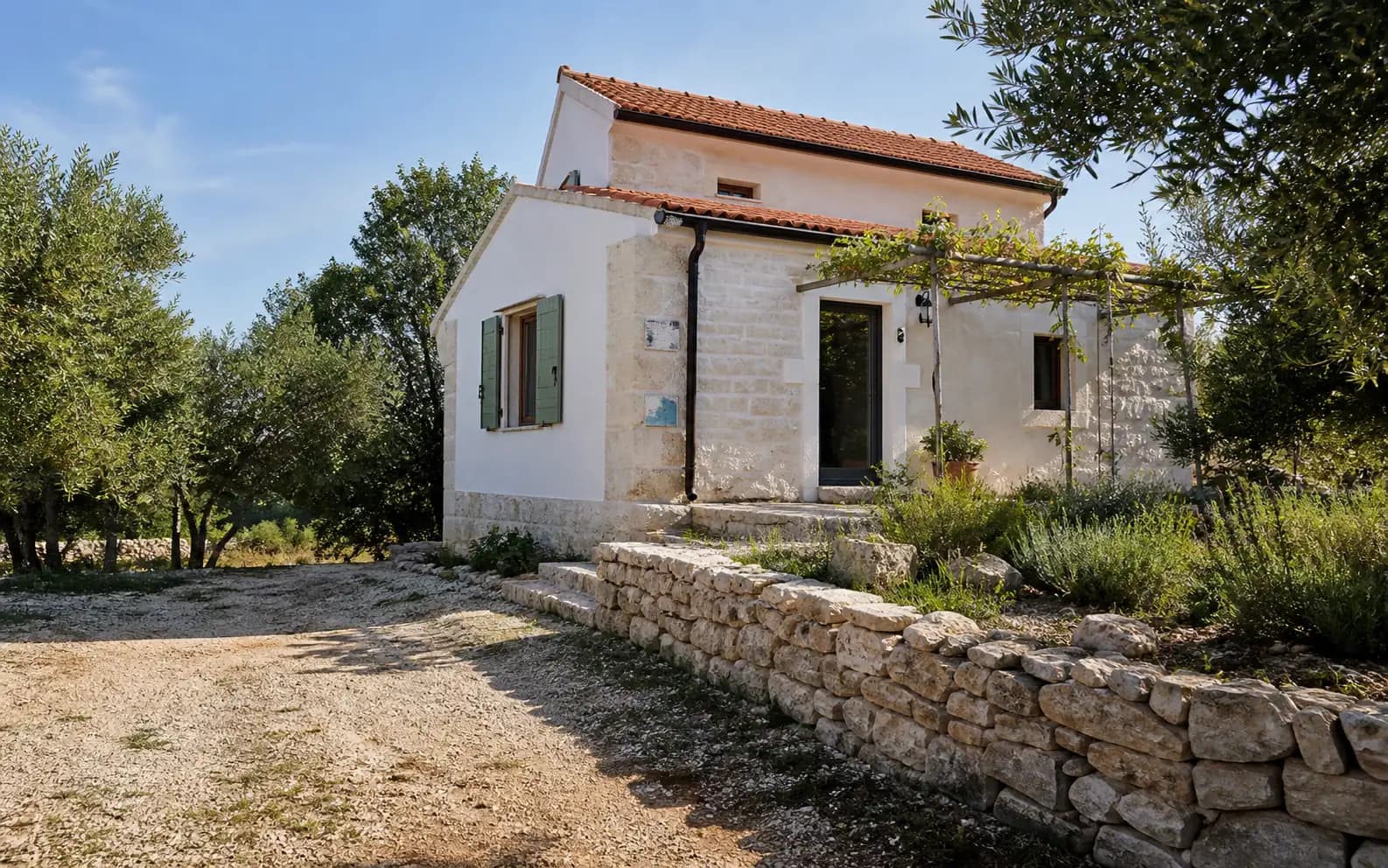 Illustrative residential exterior with stone and Mediterranean greenery in the Briševo hinterland.