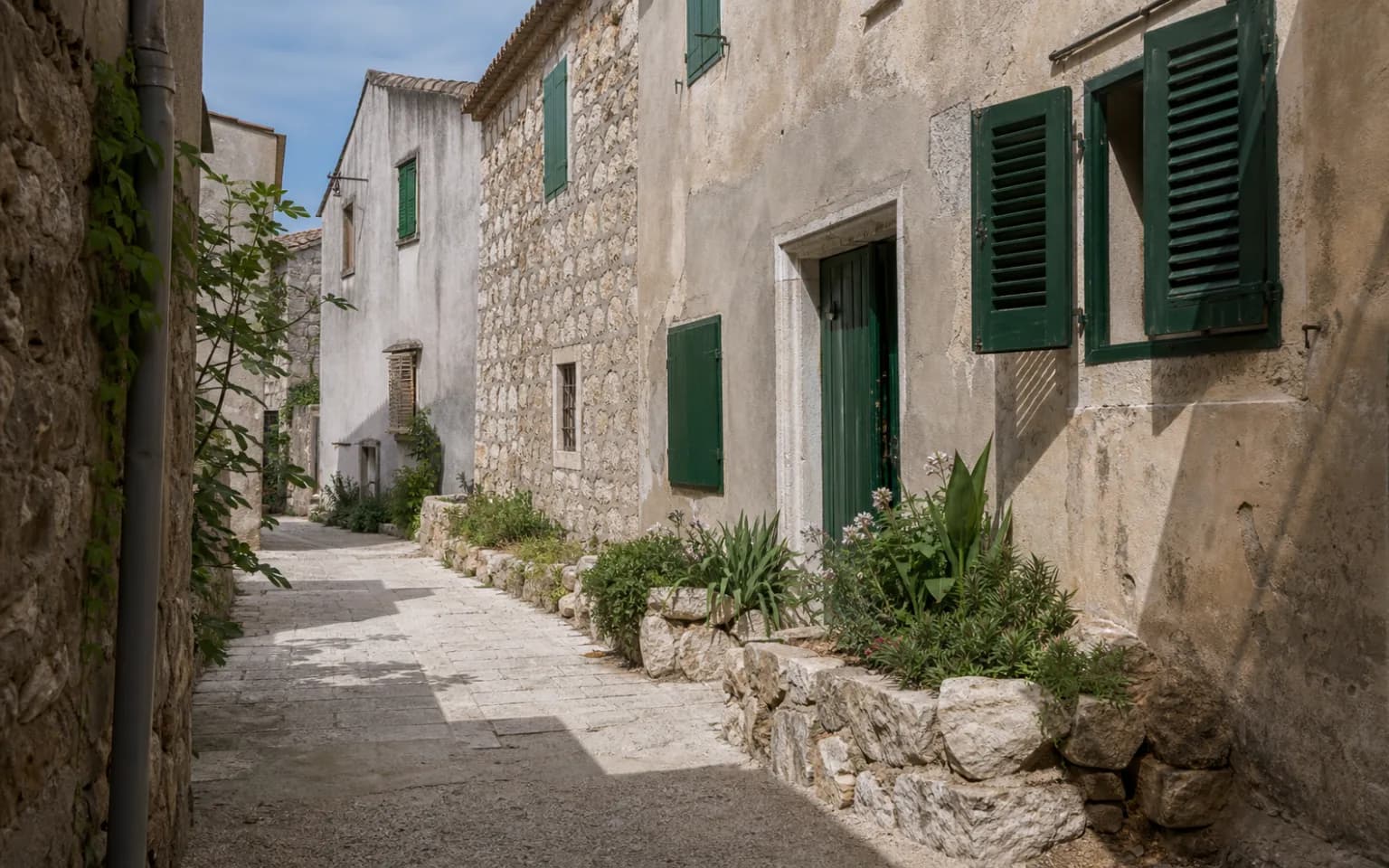 AI-generated illustrative quiet island lane with stone facades, green shutters and natural greenery in the Košljun setting.